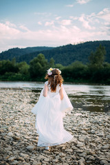 Bride in wedding dress at the beach