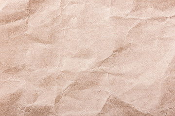 Crumpled brown paper texture.