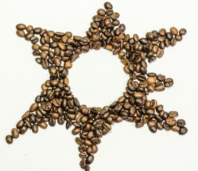 Star from coffee beans on a white background