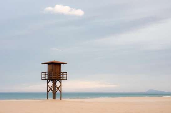 Silence on the beach. Calm Sea. watchtower on the sand.