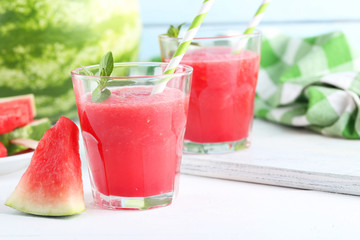 Fresh watermelon juice in the glass on wooden table
