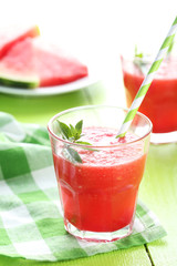 Fresh watermelon juice in the glass on wooden table