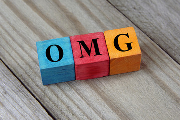 OMG text (Oh My God) on colorful wooden cubes