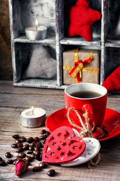 Cup decorated with wooden hearts