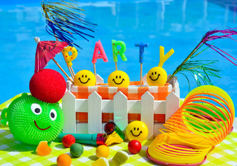 Party decorations on the swimming pool background