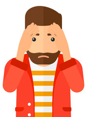 Repentant man clutching his head.