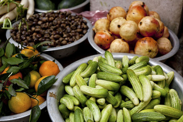 Array of bowls of food for sale on sidewalk market in Hanoi, Vietnam