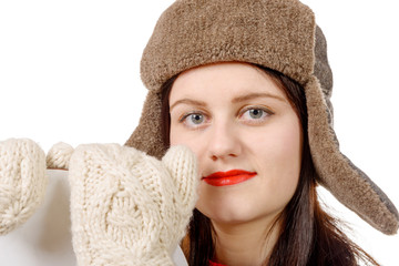 portrait of a beautiful young woman with a fur hat