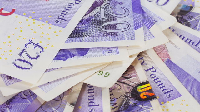 Pound sterling bank notes business background rotating, loop ready