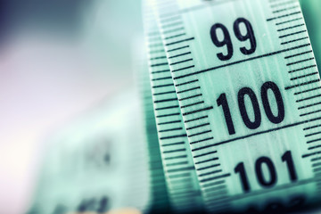Curved measuring tape. Measuring tape of the tailor. Closeup view of Green measuring tape.