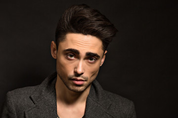 Fototapeta premium Model man isolated on black background