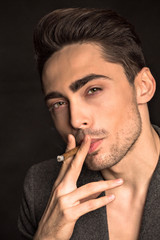 Model man smoking in studio