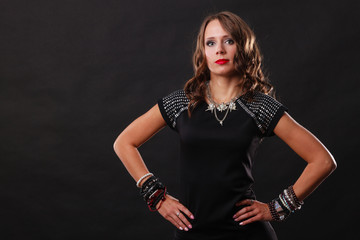 woman with jewellery in black evening dress