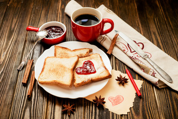  romantic Valentine's Day Breakfast , toast with butter and berry jam , black coffee with cinnamon...