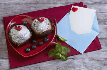 heart with two berry muffins