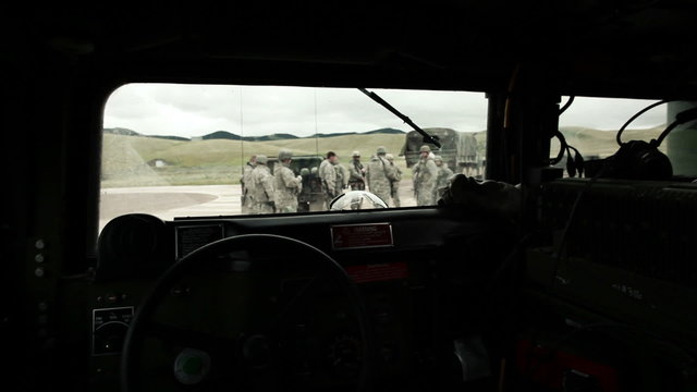 Shot From Inside Of Humvee Of Soldiers Outside.