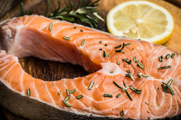 Delicious fresh salmon fillet with herbs and spices. Copy space. Healthy food or diet. Top view