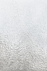 Texture ice-covered glass, close up
