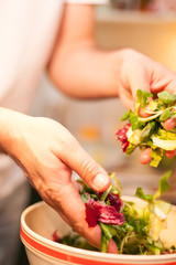 man preparing a salad