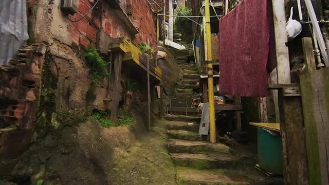Tracking shot of shanties along the stairs in a favela in Rio de Janeiro, Brazil