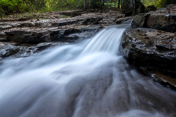 Fototapeta premium creek flowing over the rocks