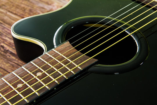 Acoustic guitar black color on the table