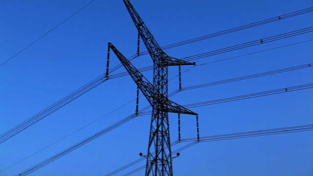 Stock Footage of a tower and power lines against the blue sky in Israel.