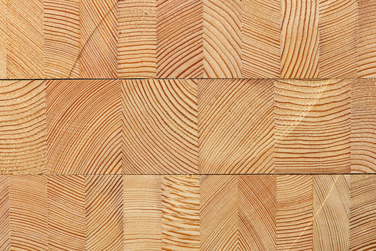 Background with glued larch wooden blocks.
