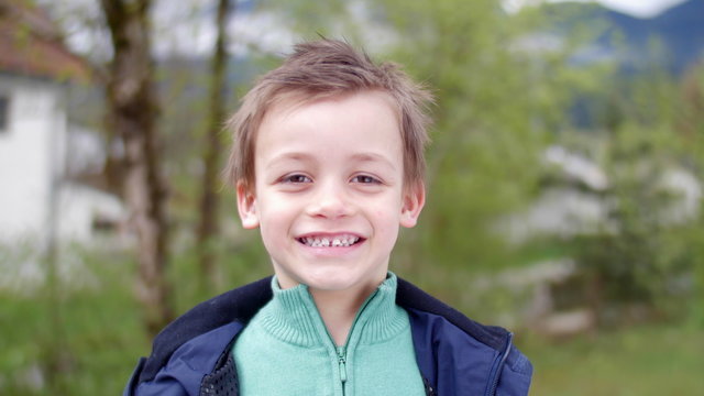 Simpathic kid smiling in camera