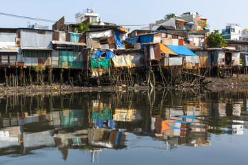 Fototapeta na wymiar Views of the city's Slums from the river. Ho Chi Minh City, Vietnam.