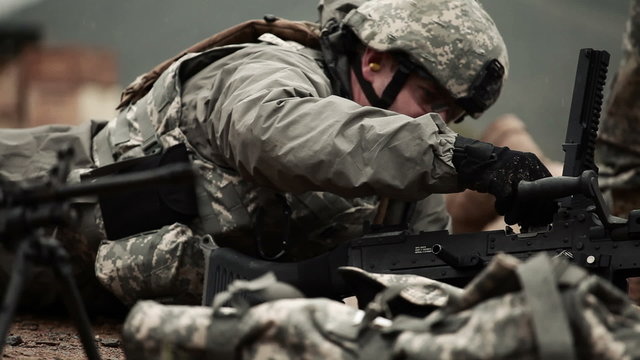 Soldier loads M240