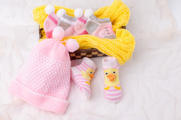 Pink knit hat and socks gift set for a newborn baby girl