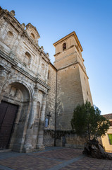 Fototapeta na wymiar Church of Our Lady of the Assumption (Nuestra Senora de La Asunción), Buendía, Cuenca, Spain. It was built in 18th century using limestone at the basement and sandstone to erect the walls.
