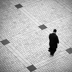 man walking on the town square