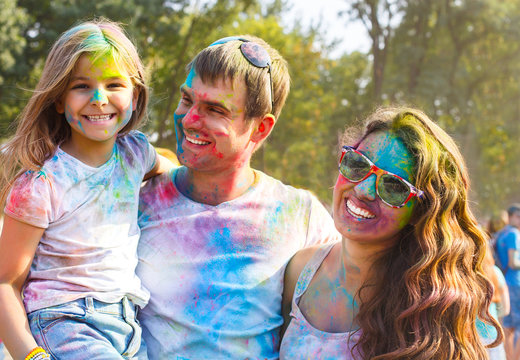 Portrait Of Happy Young Family On Holi Color Festival