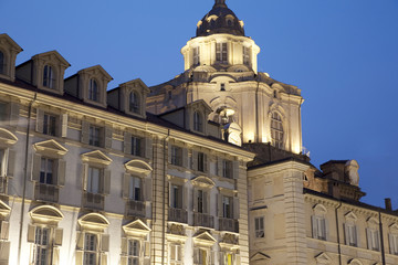 Fototapeta na wymiar St Lorenzo Church and facades on the Castello Square in Turin, Italy