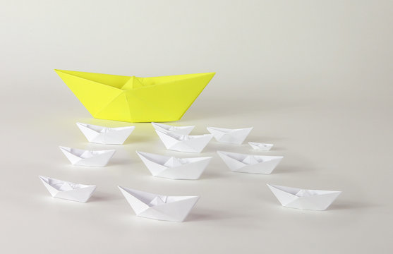 Paper ships origami on white background.