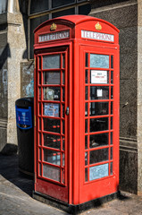 London, United Kingdom - July 23, 2012: Traditional english phone booth in London Chinatown as seen on 23rd of July, 2012.