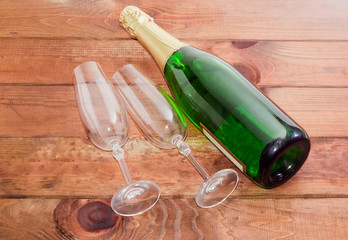 Two wine glasses and bottle with sparkling wine