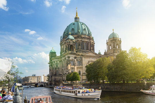 Berlin, A tour boat on the Spree River front Berlin Cathedral