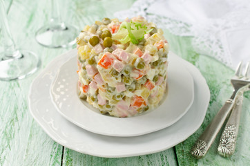 Obraz na płótnie Canvas Russian traditional salad Olivier with vegetables and meat