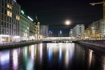 Amazing night photo of City of Geneva and Reflection in Rhone River, Switzerland