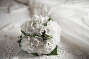 bridal bouquet on the bed