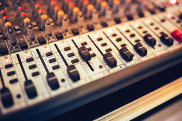 Music mixer and digital equalizer at concert or party in the nightclub
