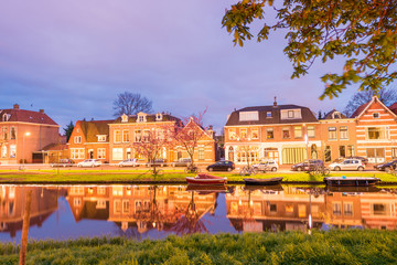 Alkmaar, Netherlands. Beautiful night view of homes over canal