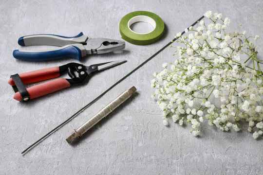 Florist at work. How to make gypsophila paniculata wedding wreat
