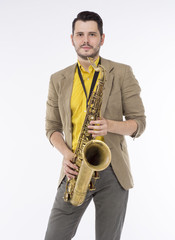 Fototapeta premium A saxophone player white background. Saxophonist jazz man with