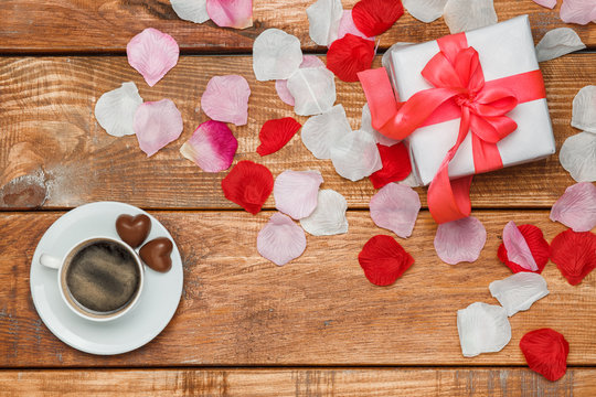 Valentines Day gift and coffee  on wooden background