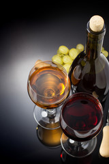 wine and wineglass on black