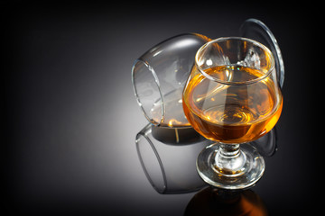 Fototapeta na wymiar cognac and glass on black